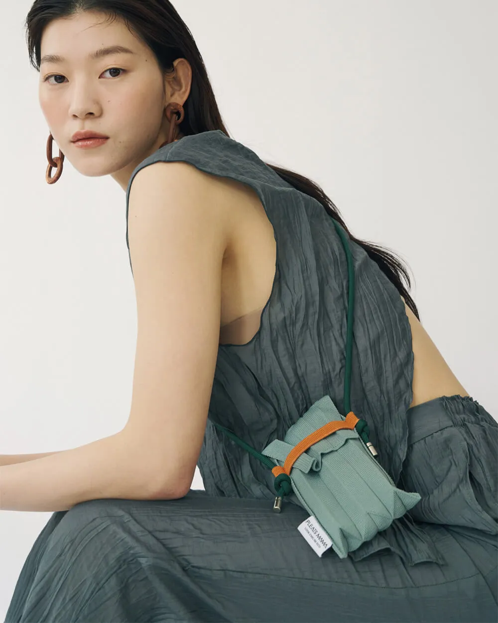 Knit Pleated Phone Bag made from Recycled Ocean Plastic - Flamingo